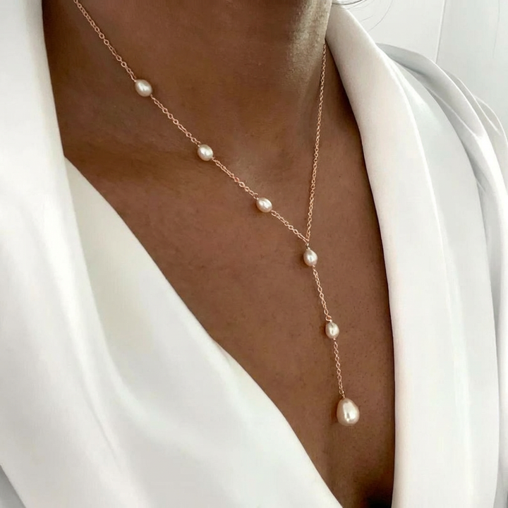 Veda Bremen vintage pendant necklace with pearls and intricate metal charm, elegant jewelry accessory.