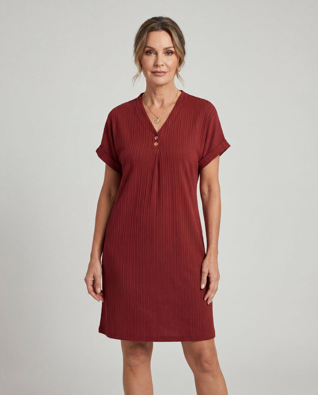 LuroLondon V-neck short sleeve dress featuring a fitted silhouette and elegant design, shown in a stylish outdoor setting.
