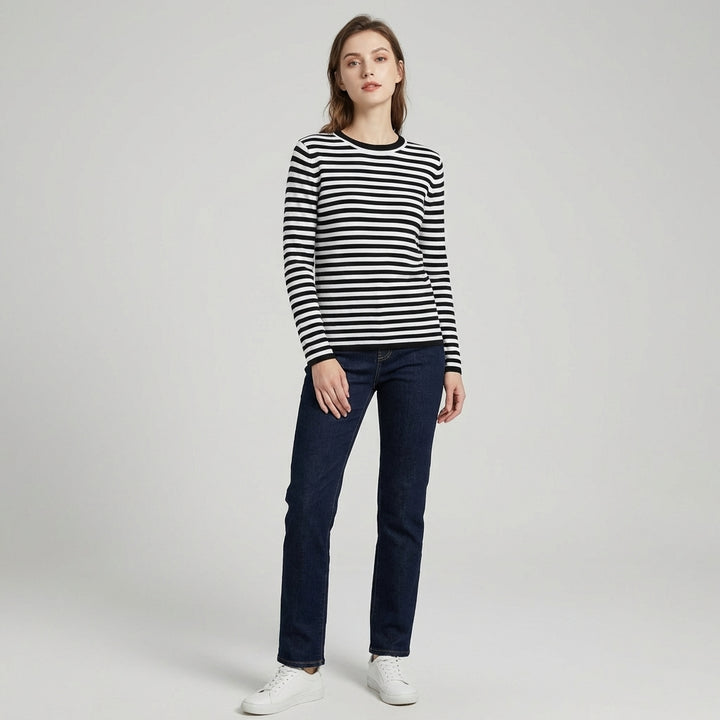 Veda Bremen elegant long-sleeve top in black, featuring a fitted design and round neckline, displayed on a hanger.