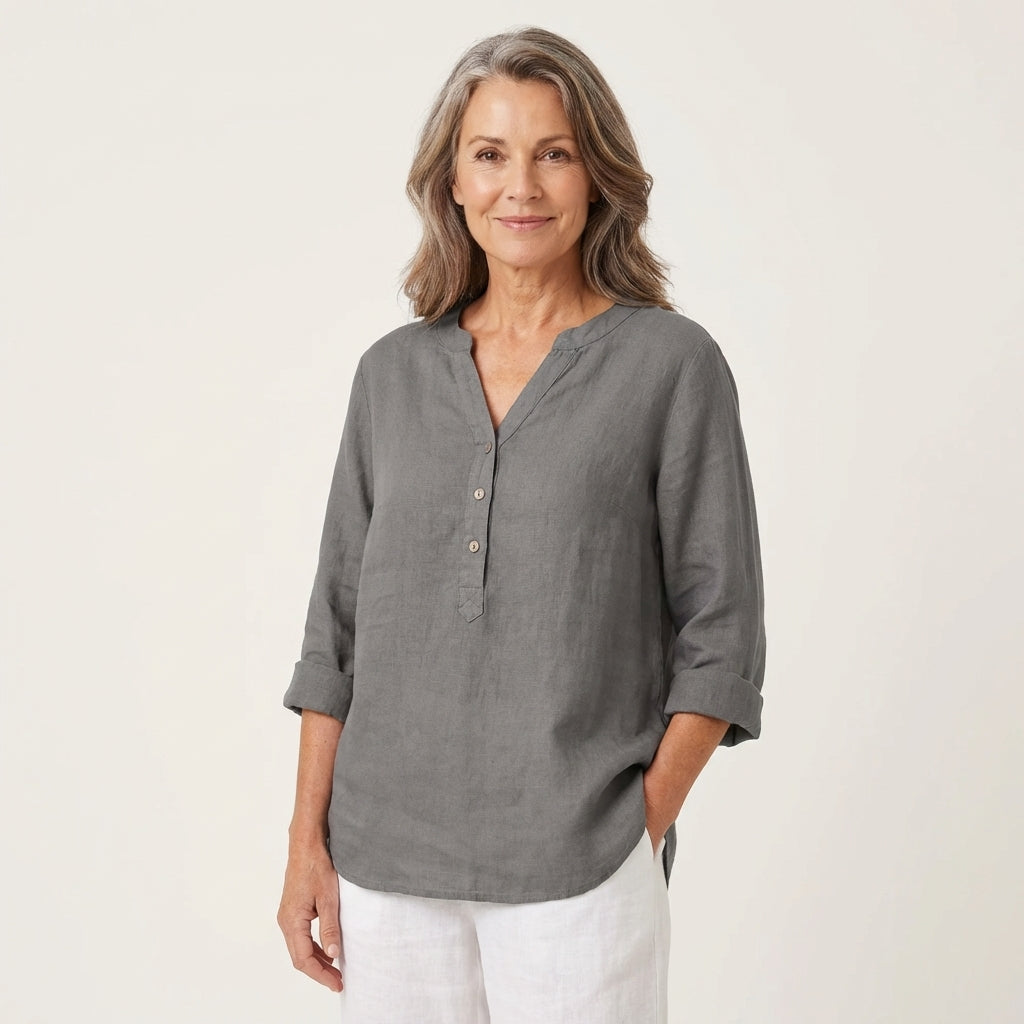Veda Bremen Reja button-up shirt in soft fabric, featuring a classic collar and front buttons, displayed on a hanger.
