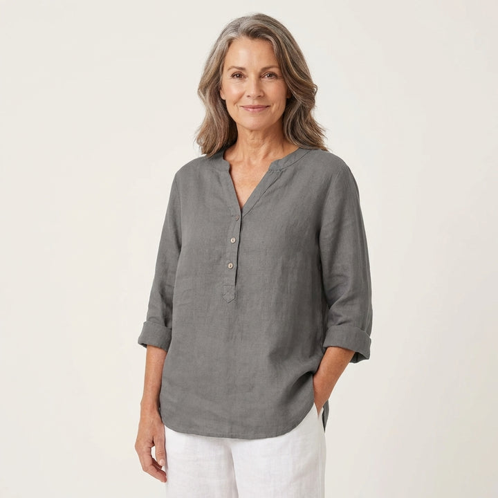 Veda Bremen Reja button-up shirt in soft fabric, featuring a classic collar and front buttons, displayed on a hanger.