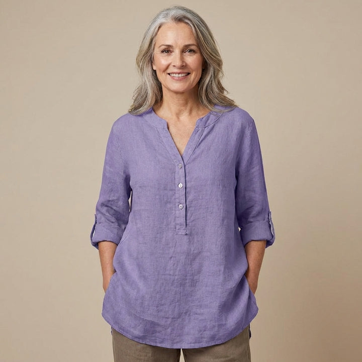 Veda Bremen Reja button-up shirt in light fabric with a classic collar and long sleeves, displayed on a hanger.