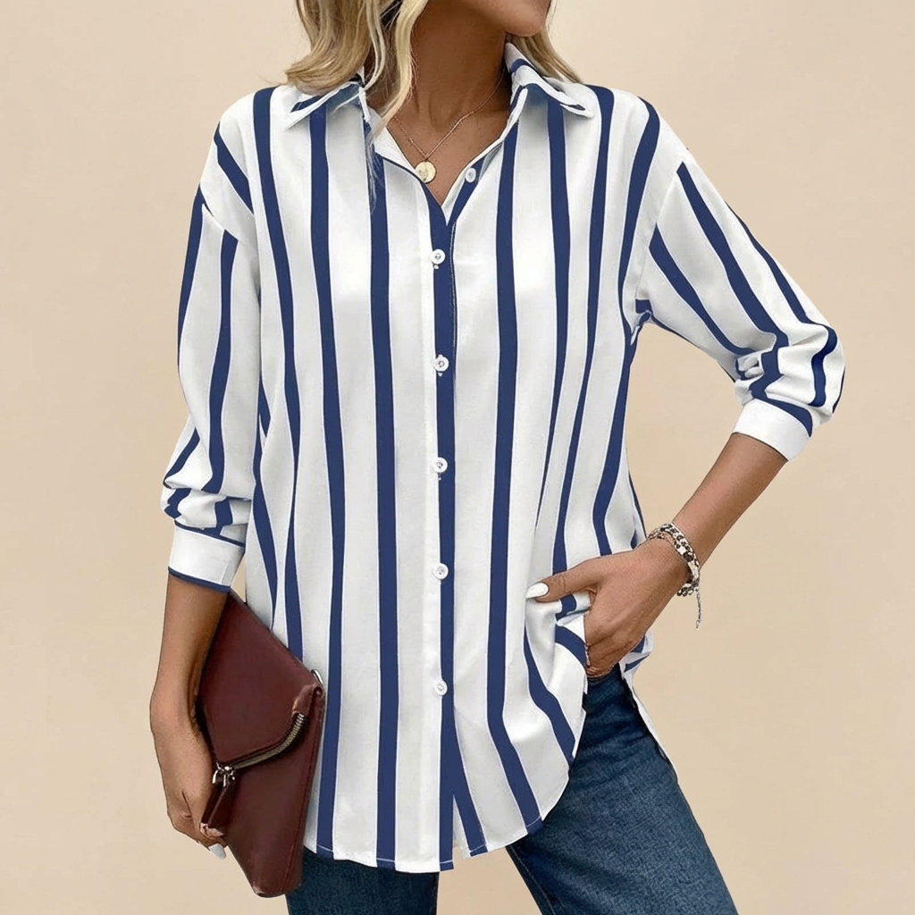 Veda Bremen Lisa Bluse with classic striped pattern, featuring long sleeves and a relaxed fit, displayed on a hanger.