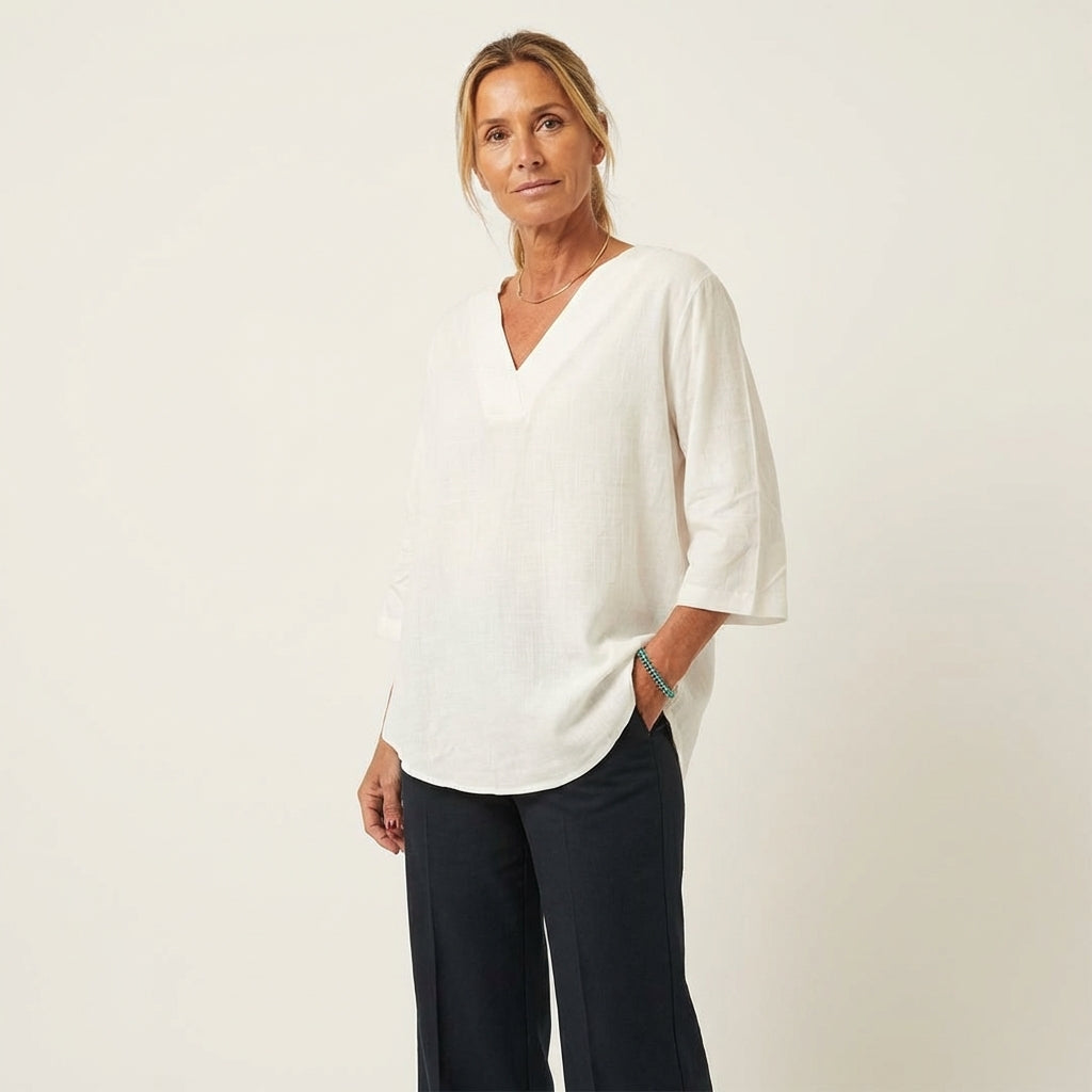 Veda Bremen Amy stylish women's shirt in a light, breathable fabric with a classic button-up design, displayed flat.