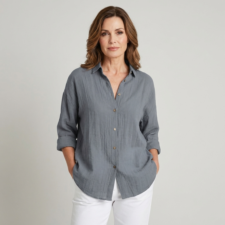Veda Bremen Musselin blouse featuring lightweight, soft fabric with a relaxed fit and long sleeves, displayed on a neutral background.