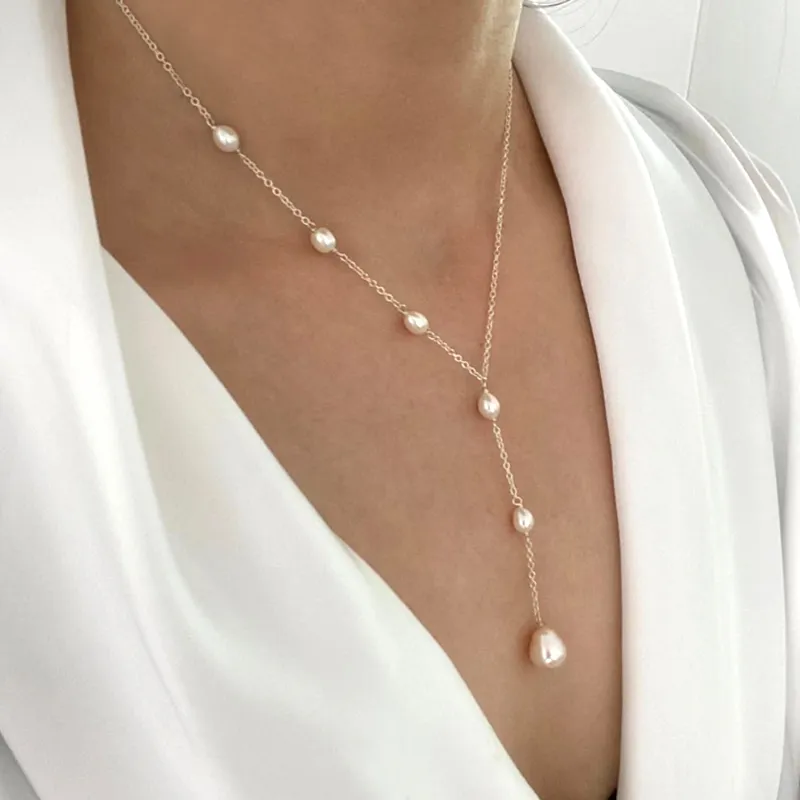 Veda Bremen vintage necklace with pendant and pearl accents, featuring intricate design and elegant craftsmanship.