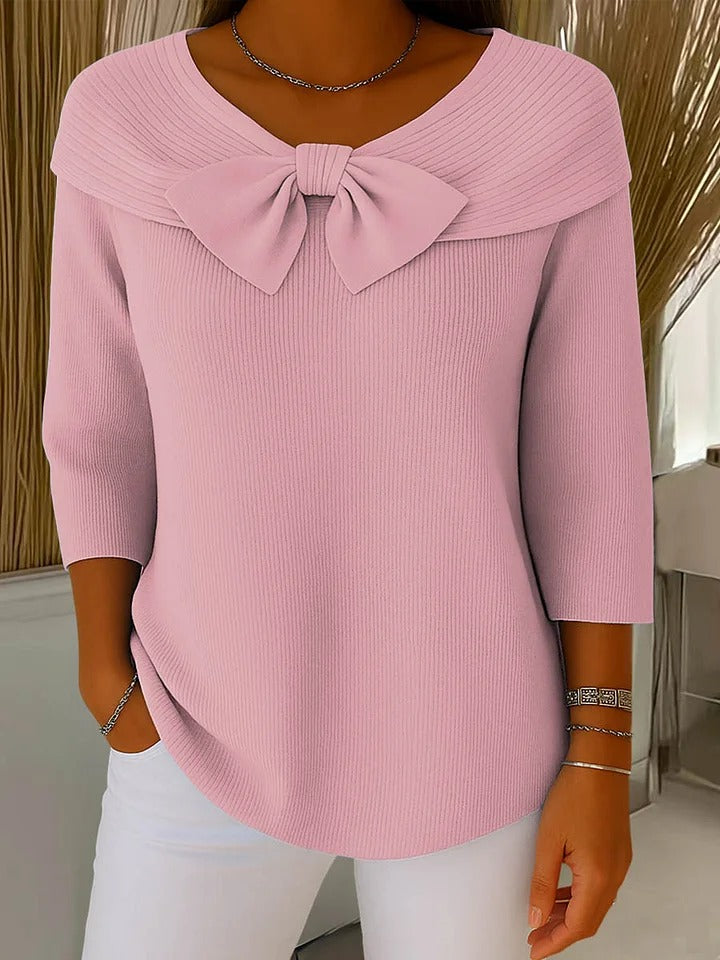 LuroLondon Fiona Bow Sweater featuring a cozy knit design with a decorative bow detail, worn by a model.