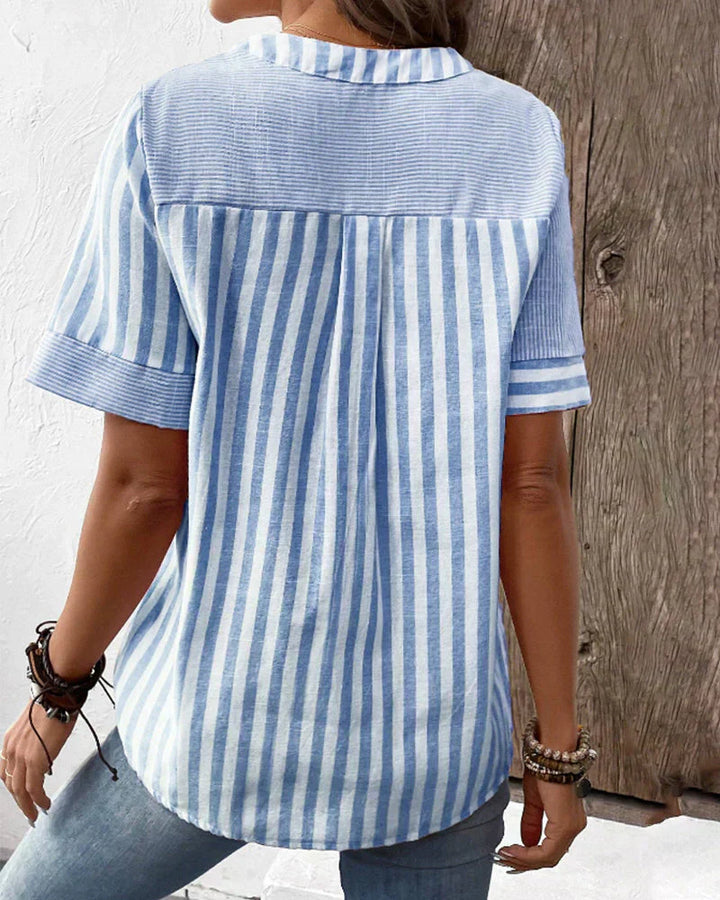Veda Bremen Talia elegant striped blouse with long sleeves and classic collar, displayed on a hanger.
