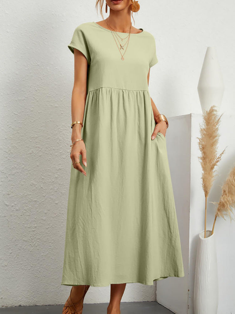 Light green Gabrielle midikleid with flowing silhouette by Veda Bremen, showcasing its elegant, relaxed fit and soft fabric.