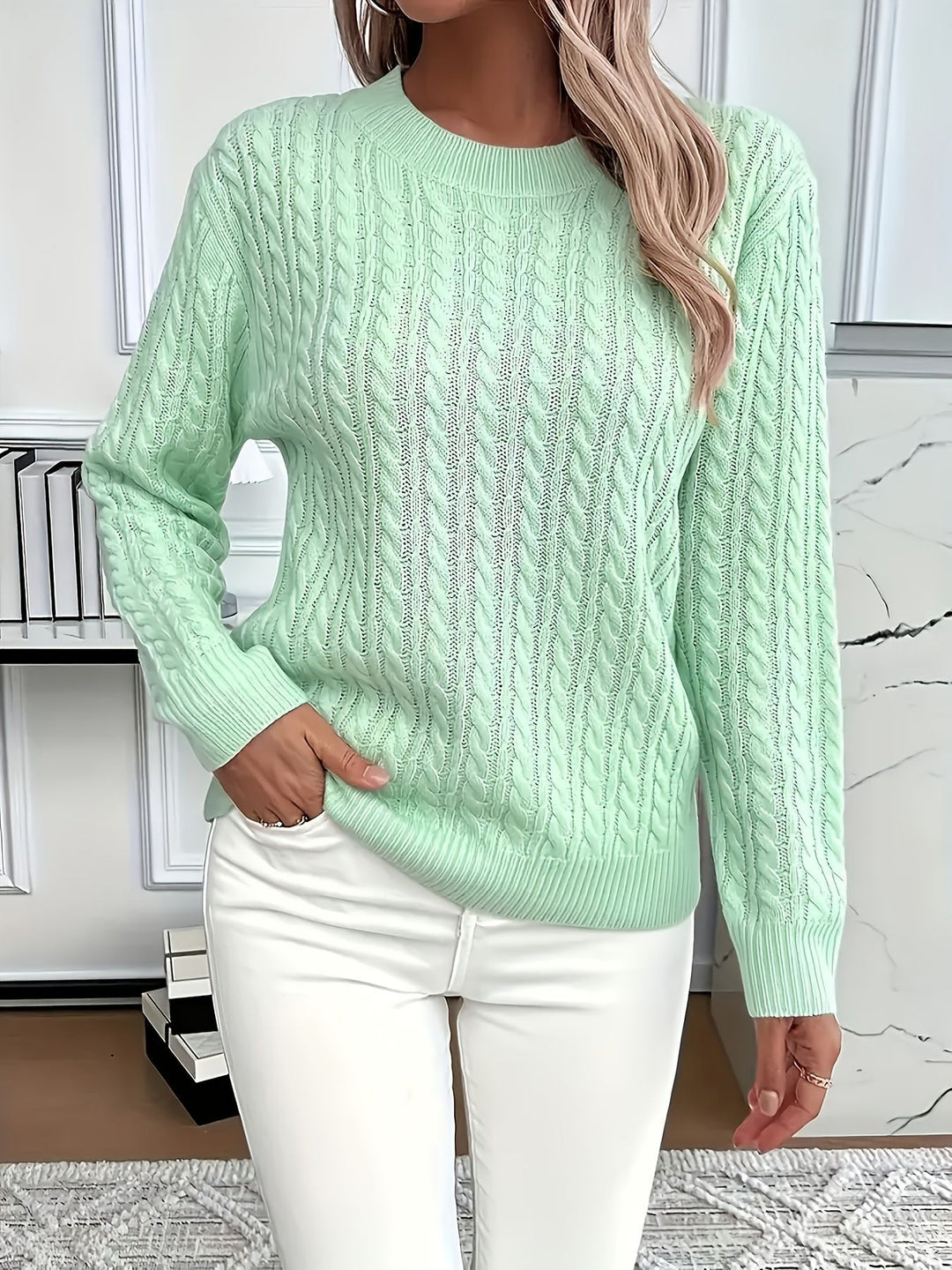Light green Rosa knitted sweater from Lurolondon.co.uk featuring a cozy, textured knit pattern and a relaxed fit.