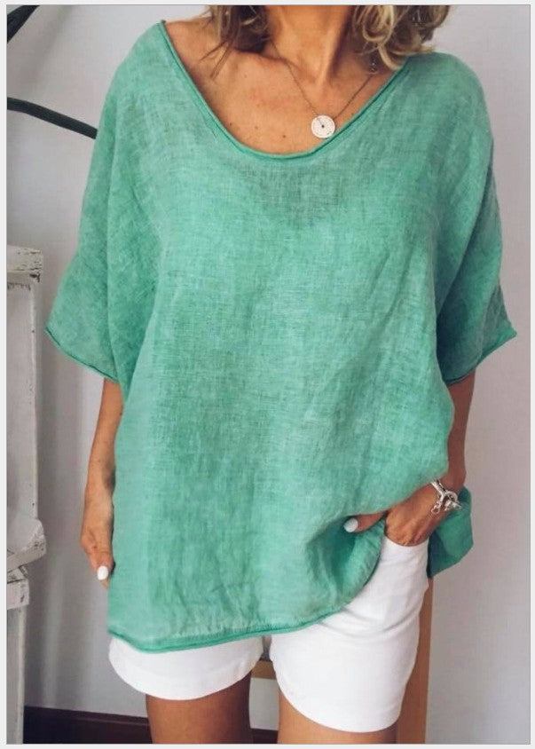 Light green Vivian versatile linen blouse by Veda Bremen, featuring a relaxed fit and natural fabric details.