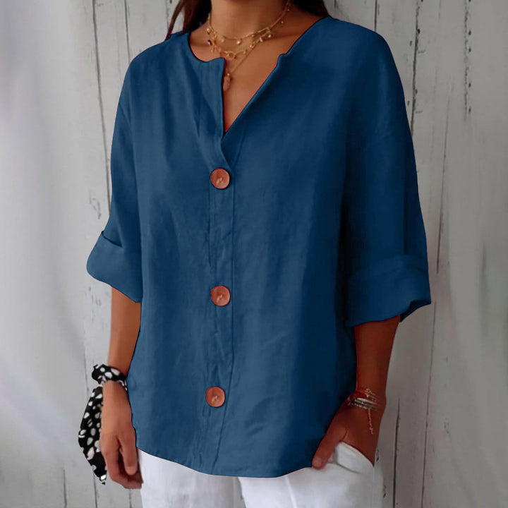 Navy blue Leah minimalist blouse by Veda Bremen, showcasing a sleek, simple design with a classic fit and smooth fabric.