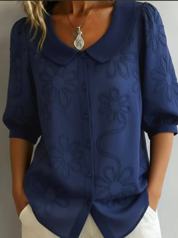 Navy blue Aggie lightweight floral blouse by Veda Bremen, featuring a relaxed fit and delicate flower print.
