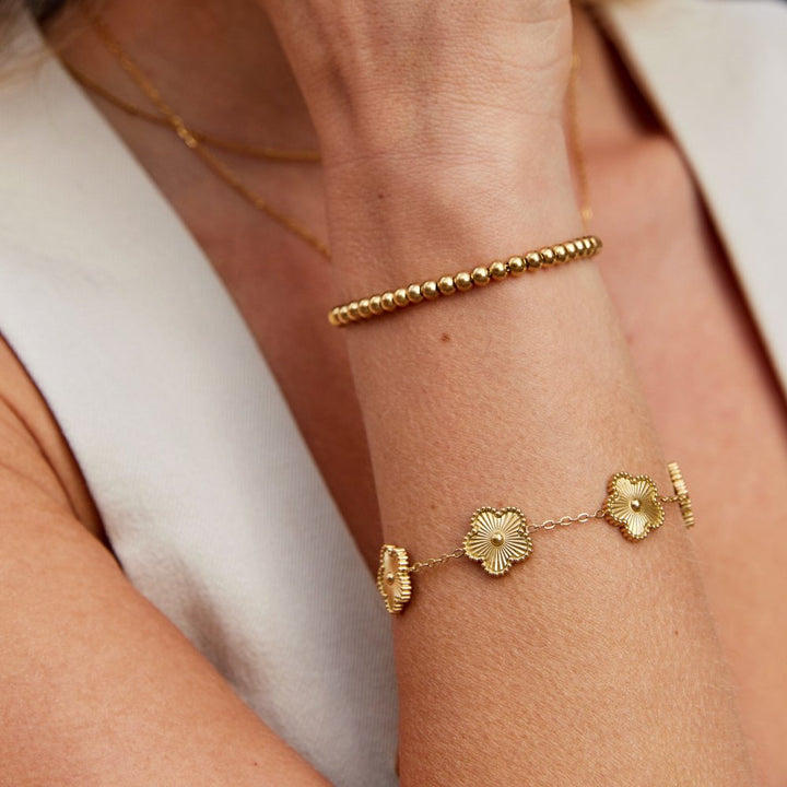 Gold beaded bracelet by Veda Bremen featuring delicate pearl accents and an elegant design.
