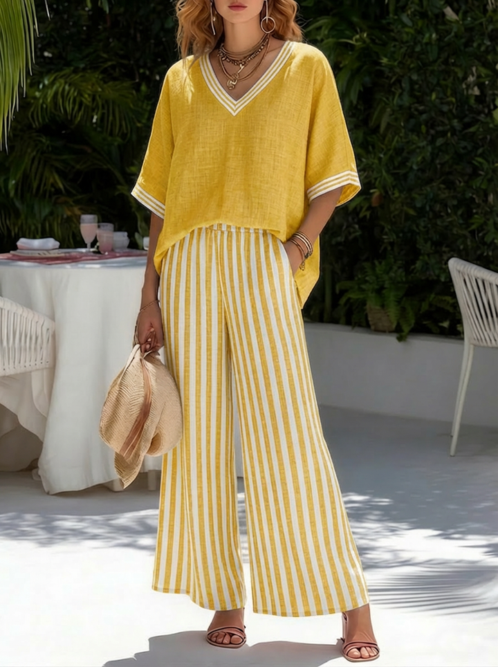 Veda Bremen Alira striped linen two-piece set with breathable fabric and stylish design, laid flat for display.