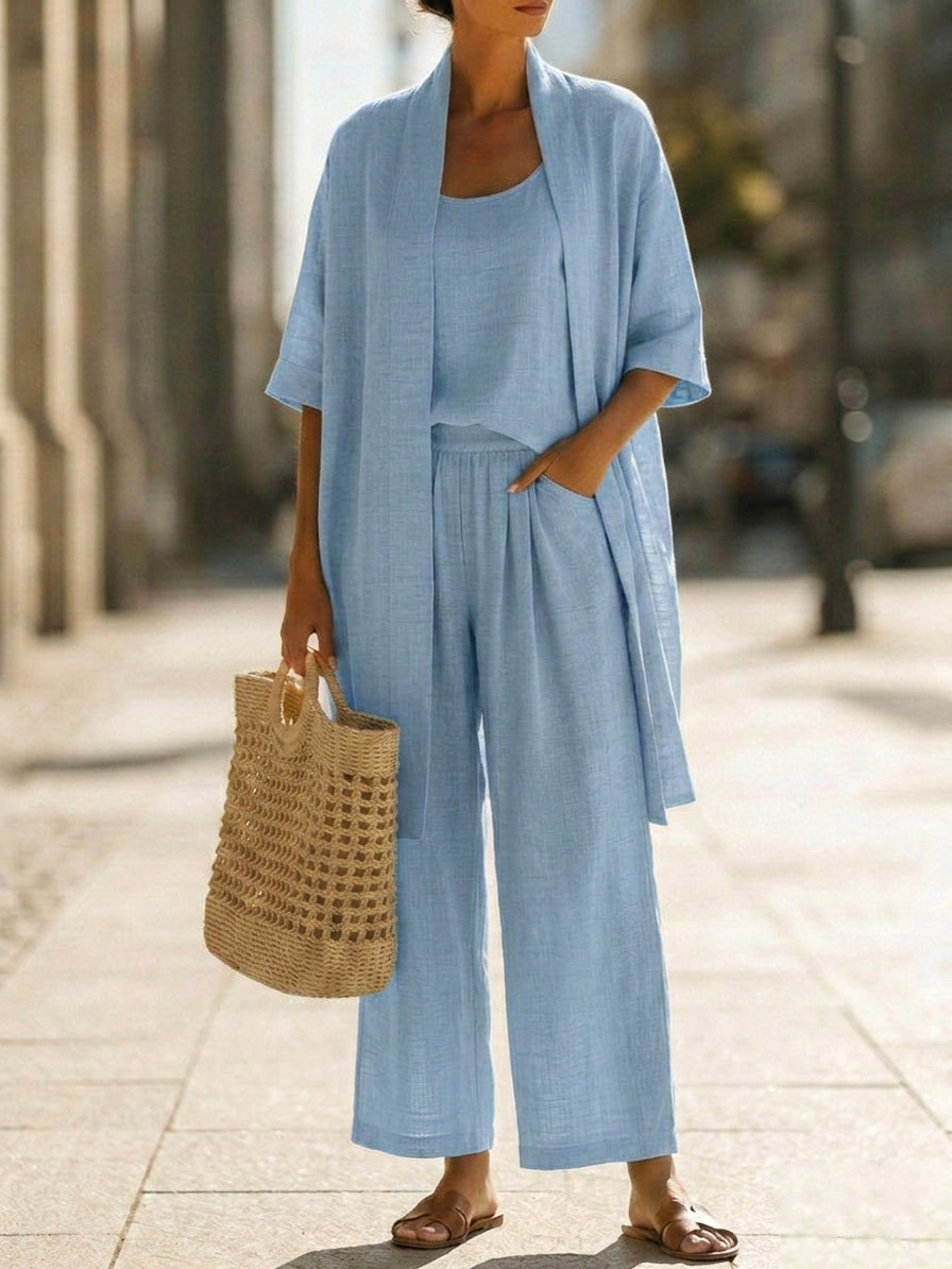 Veda Bremen Linnea lightweight linen set displayed on a hanger, featuring a casual and breathable linen fabric in natural tones.