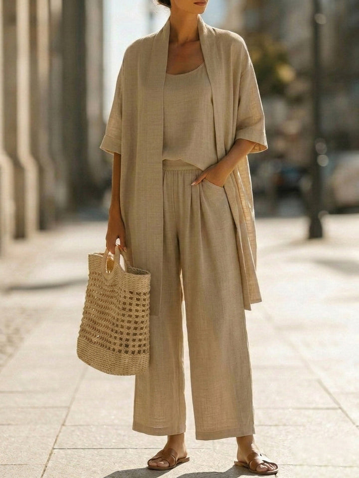 Veda Bremen Linnea lightweight linen set displayed on a hanger, showcasing soft, breathable fabric and natural beige color.