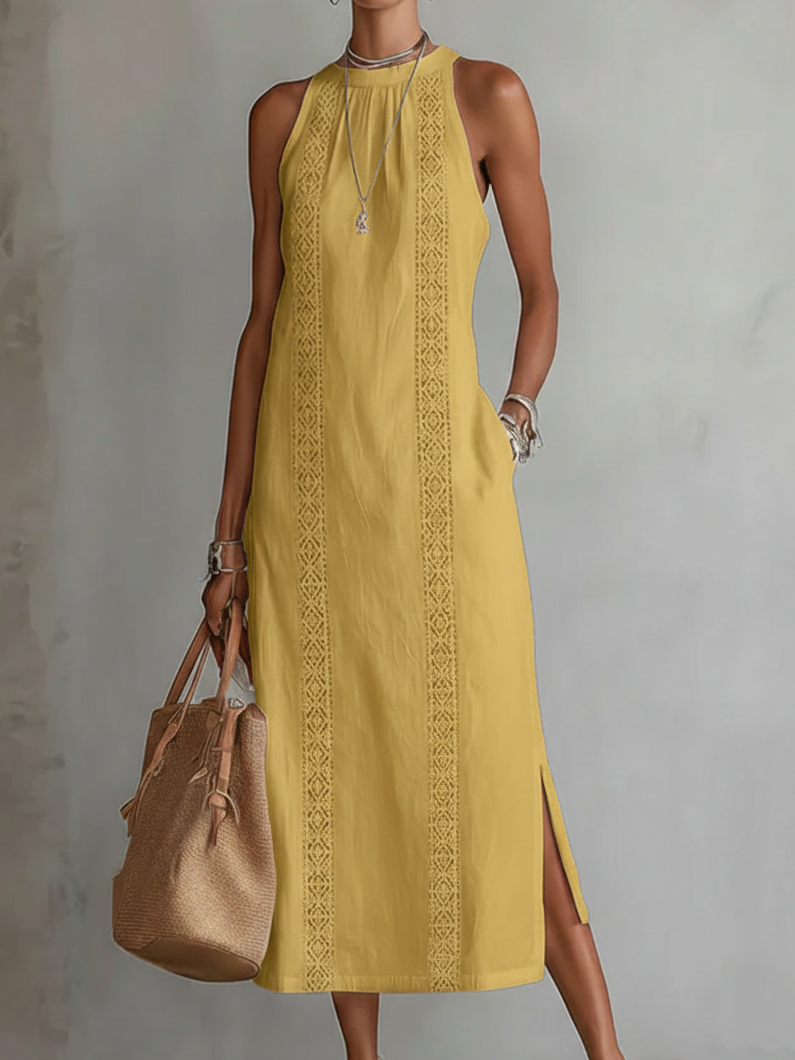 Jimena Veda Bremen embroidered mandarin-collar midi dress hanging on a wooden hanger, showcasing intricate needlework and relaxed fit.