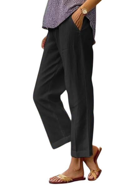 Black Lisa lightweight trousers by LuroLondon, showcasing a slim fit with a smooth fabric and modern design.