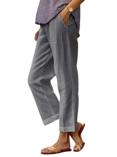 Dark grey LuroLondon Lisa lightweight trousers displayed flat, showcasing their slim fit and soft, breathable fabric.