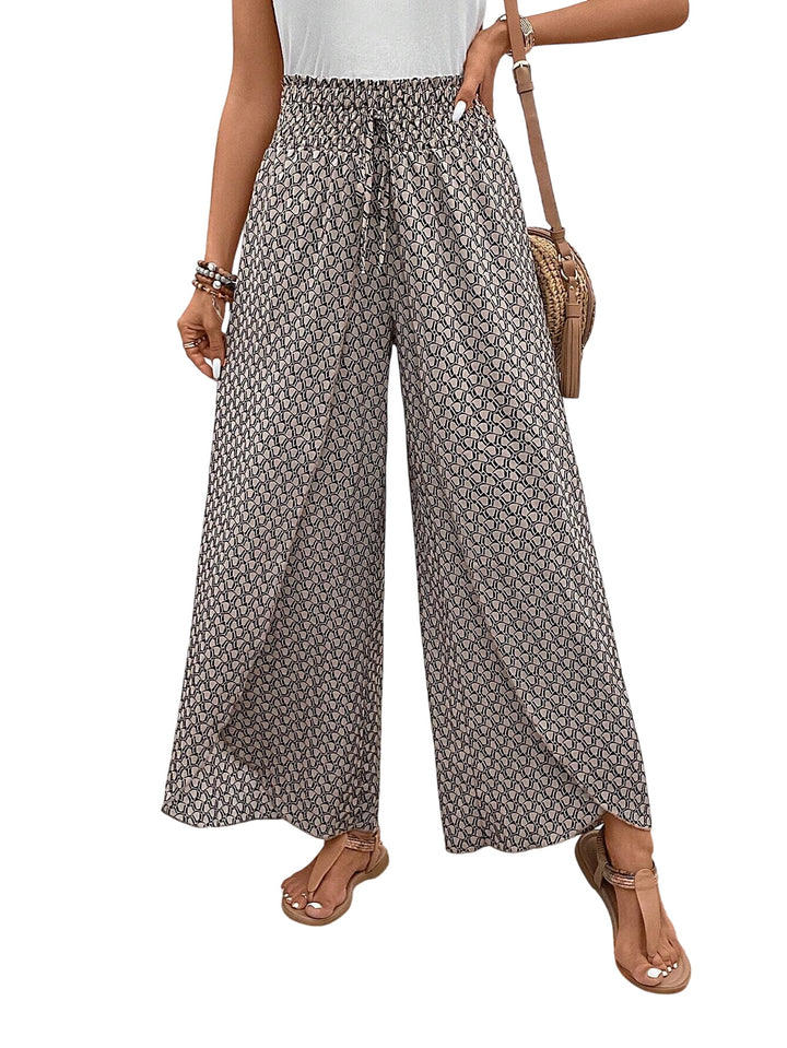 Veda Bremen Stella wide-leg printed pants in grey with a relaxed fit and bold graphic design on the fabric.