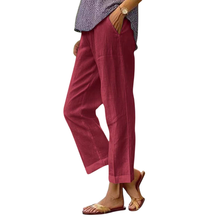 Red Lisa lightweight trousers by LuroLondon, featuring a relaxed fit and casual style, shown on a model.