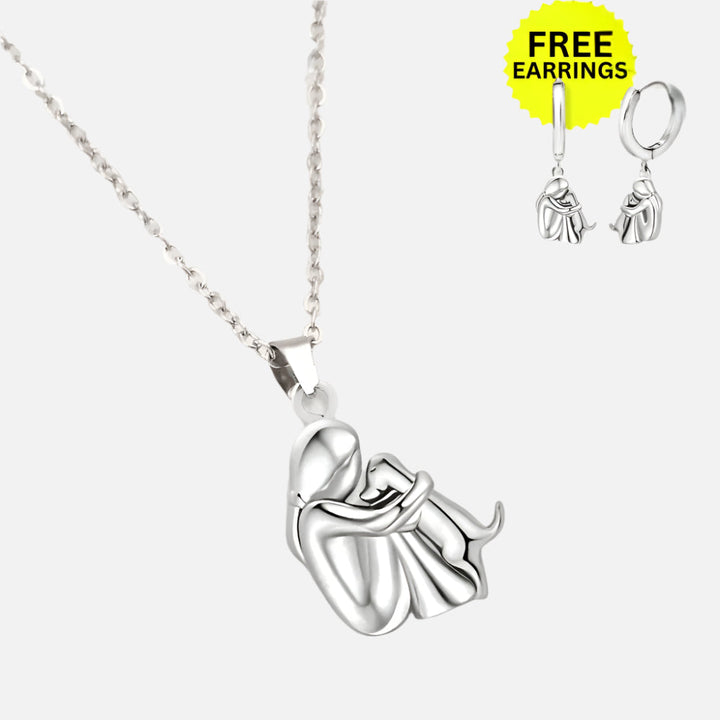 Veda Bremen necklace with hug pendant and free matching earrings, stylish jewelry set displayed on a neutral background.