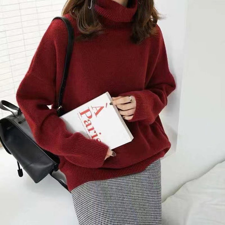 LuroLondon Marilou Cashmere Turtleneck in vibrant red, showcasing a cozy, soft cashmere knit with a high neckline and long sleeves.