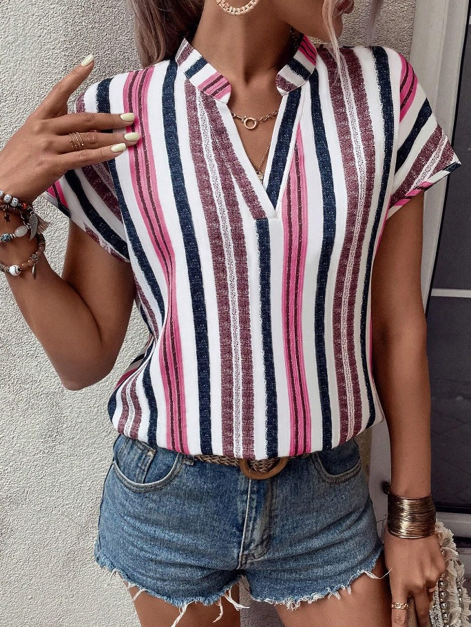 Red striped Veda Bremen tunic with V-neck, lightweight and casual, shown on a hanger.