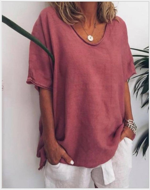 Red Veda Bremen Vivian versatile linen blouse displayed on a hanger, showcasing lightweight fabric and relaxed fit.