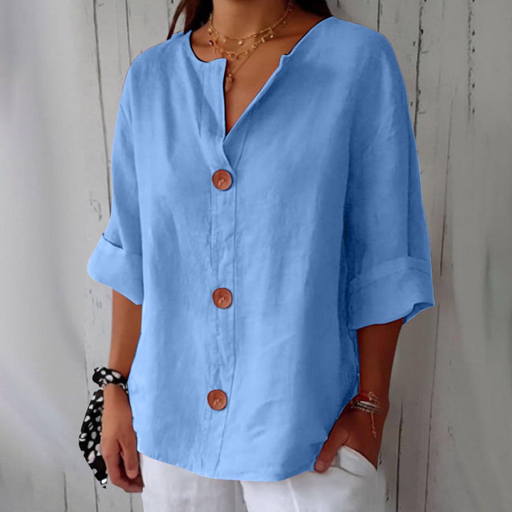 Sky blue Leah minimalist blouse by Veda Bremen, featuring a relaxed fit and simple design, perfect for casual or office wear.