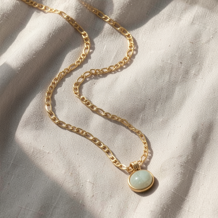 Veda Bremen jade necklace pendant hanging on a delicate chain, showcasing elegant luxury jewelry in a neat display.