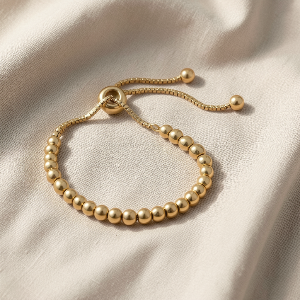 Veda Bremen gold beaded bracelet with intricate pearl detailing, elegant jewelry accessory on a neutral background.
