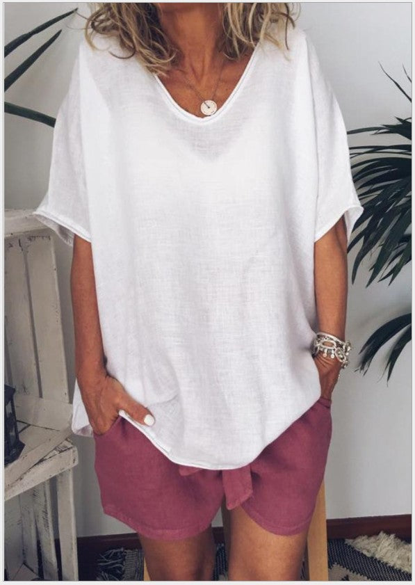 White Veda Bremen Vivian versatile linen blouse displayed on a mannequin showcasing its relaxed fit and breathable fabric.