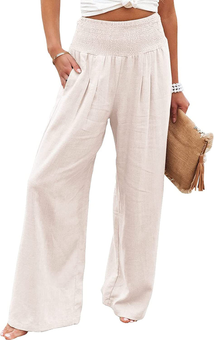 White Romy wide-leg pants by Veda Bremen, shown on a model, featuring a relaxed fit and high waist design.