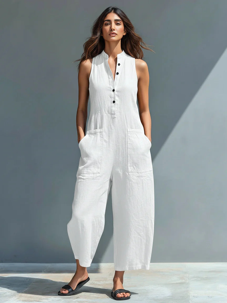 White Veda Bremen Lotte sleeveless minimalist jumpsuit displayed on a mannequin. Simple, elegant design with clean lines.