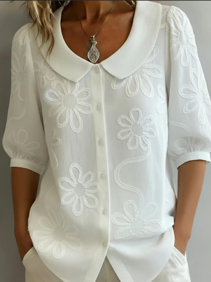 White Aggie Veda Bremen lightweight floral blouse with delicate flower patterns and a relaxed fit.