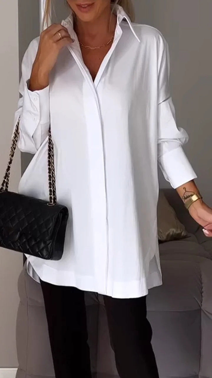 White Alysha oversize shirt from Lurolondon.co.uk shown on a hanger, featuring a relaxed fit and casual style.
