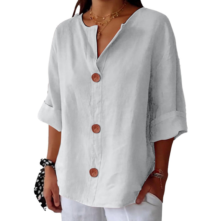 White Leah minimalist blouse by Veda Bremen, featuring clean lines and simple design, displayed on a neutral background.