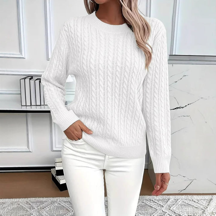 White Rosa knitted sweater by Lurolondon.co.uk, featuring a cozy, textured knit and classic crewneck design.