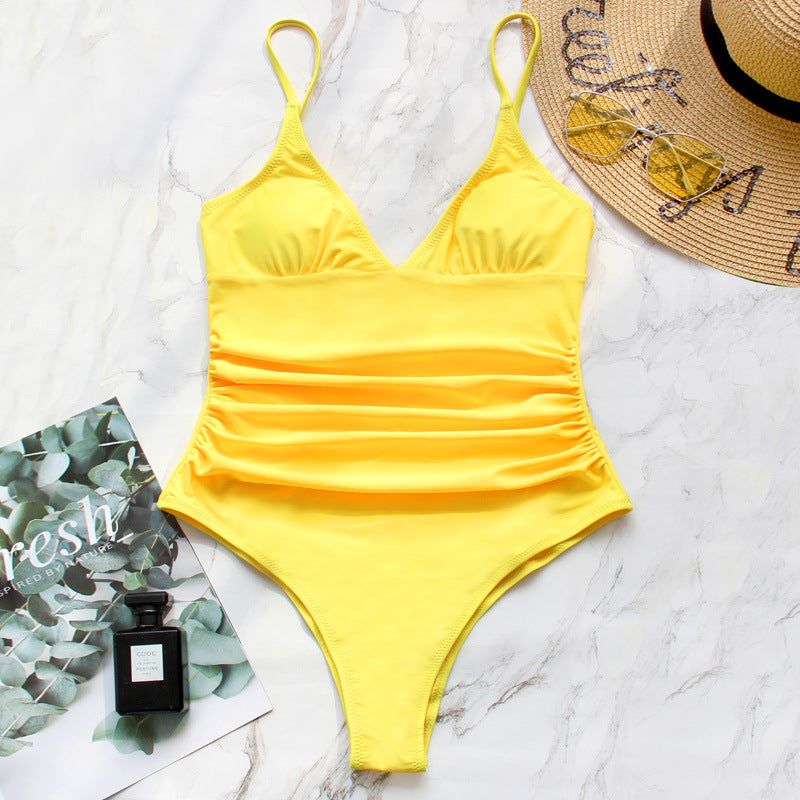 Yellow Serena Veda Bremen one-piece swimsuit with a sleek, fitted design, perfect for beach or poolside wear.